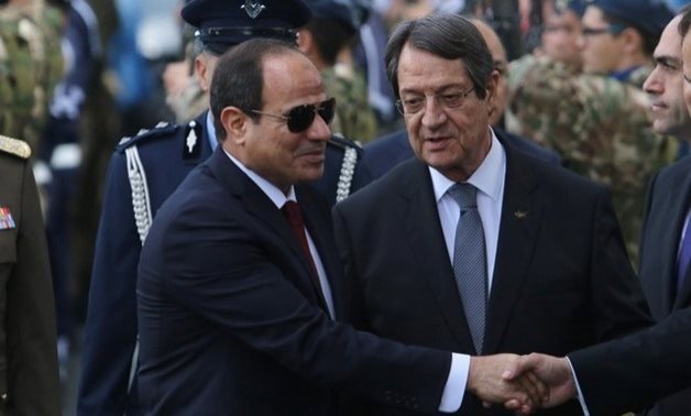 Cypriot President Nicos Anastasiades (R) and Egyptian President Abdel Fattah al-Sisi are seen during a welcome ceremony the Presidential Palace in Nicosia, Cyprus November 20, 2017. REUTERS/Yiannis Kourtoglou