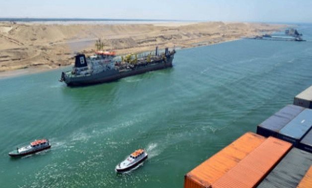 FILE - A ship transiting through Suez Canal - SCA