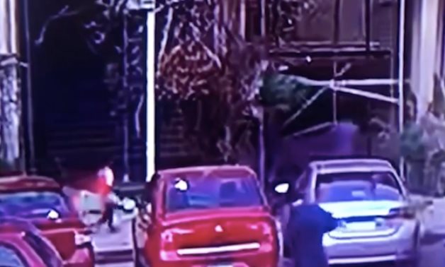 Screen shot of video showing harasser luring girl into Maadi building 
