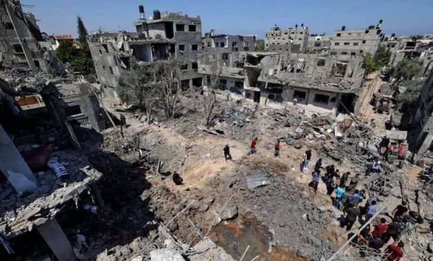 FILE - Buildings destroyed by Israeli strikes against Gaza Strip on May 13, 2021. Palestine News and Information Agency (WAFA)