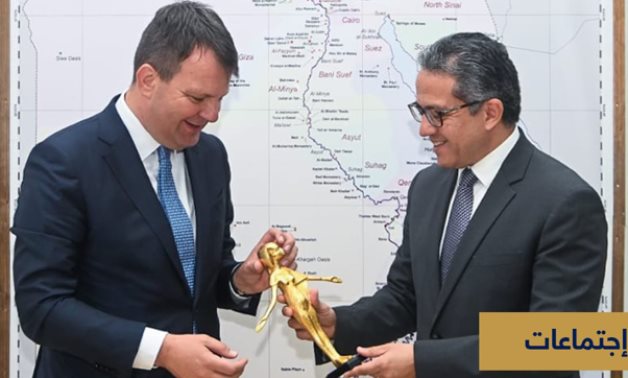 Egypt's Min. of Tourism & Antiquities Khaled el-Enany [R] presenting a souvenir to Governor of Vojvodina Igor Mirovic - Min. of Tourism & Antiquities