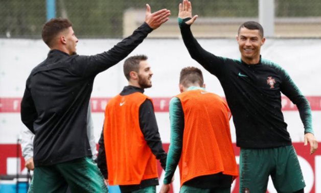 Portugal's Cristiano Ronaldo and Ruben Dias during training REUTERS