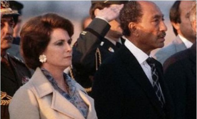 FILE - Gihane El-Sadat stands beside then-President Anwar El-Sadat