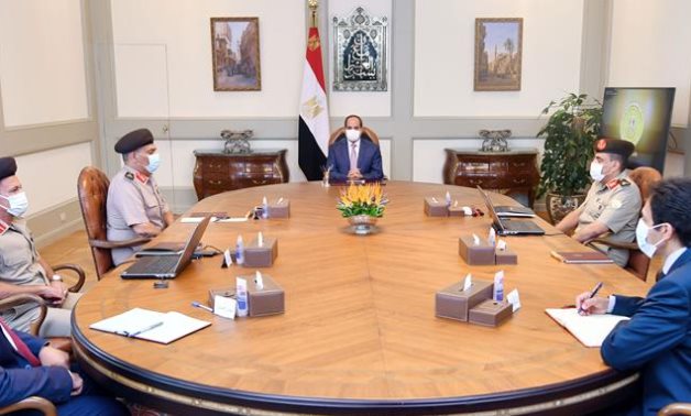 Egyptian President Abdel Fattah El Sisi meets with Head of the Armed Forces Engineering Authority Ehab El-Far and other officials- press photo