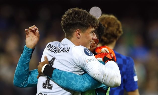 Chelsea's Kepa Arrizabalaga celebrates with teammates after winning the penalty shoot-out, Reuters