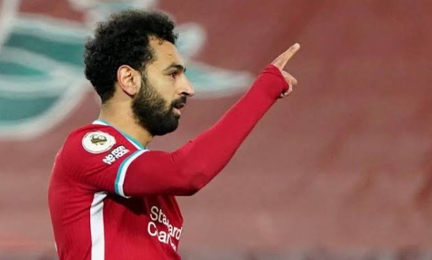 Salah celebrates scoring for Liverpool at Anfield, Reuters