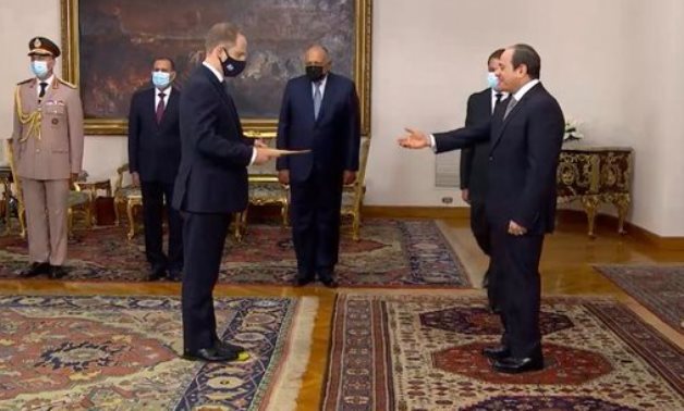 British Ambassador to Egypt Gareth Bayley hands his papers to the president Abdel Fatah al-Sisi