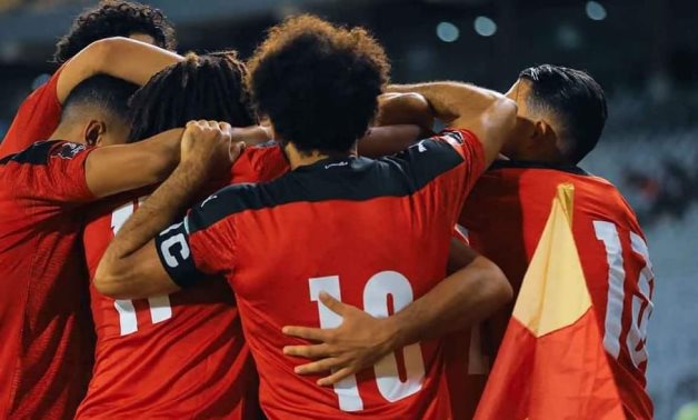 File- Egypt national team players celebrate scoring against Libya 