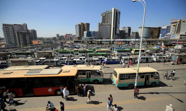 People walk through Megenagna neighbourhood bus station in Addis Ababa, Ethiopia November 3, 2021. REUTERS/Tiksa Negeri/File Photo
