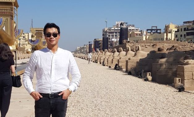 South Korean ambassador to Egypt Hong Jin-wook poses for a photo in the newly-reopened Avenue of Sphinxes- photo courtesy of his official Twitter account.