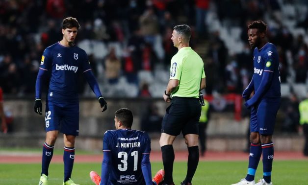 Referee Manuel Mota ends the match early after Belenenses started the match with 9 players due to a COVID-19 outbreak in the club and Joao Monteiro sustains an injury REUTERS/Pedro Nunes