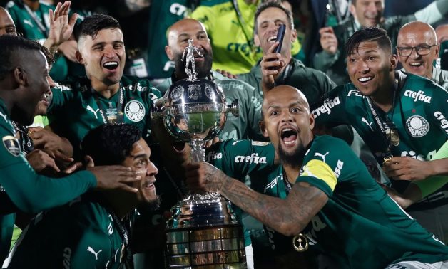 Palmeiras' Felipe Melo, Gustavo Gomez and teammates celebrate winning the Copa Libertadores with the trophy REUTERS/Agustin Marcarian