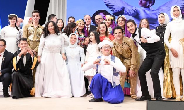 President Sisi and 'children with determination' pose for a picture at the 2021 Differently-Abled celebration.- press photo