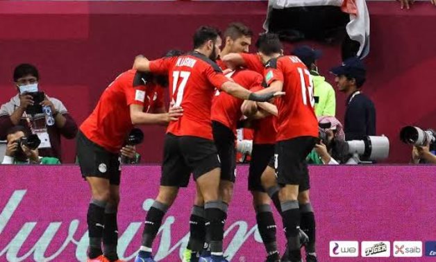 File - Egypt national team players celebrate scoring in the FIFA Arab Cup
