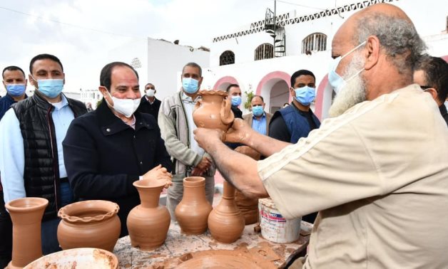 President Abdel Fattah El Sisi, on Friday afternoon, inspected a number of development projects in Old Cairo, where he listened to workers at handmade pottery shop- press photo