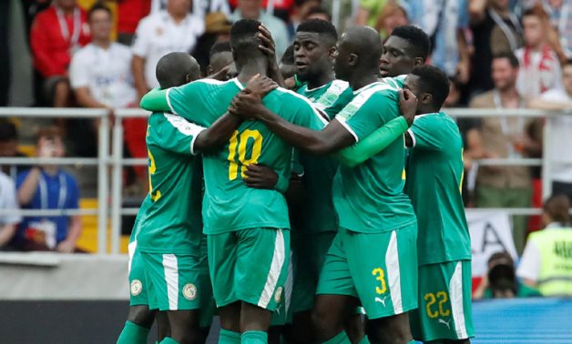Senegal players celebrate scoring against Poland in the 2018 World Cup, Reuters 