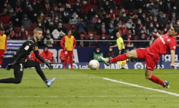 Atletico Madrid's Luis Suarez shoots at goal REUTERS/Nacho Doce