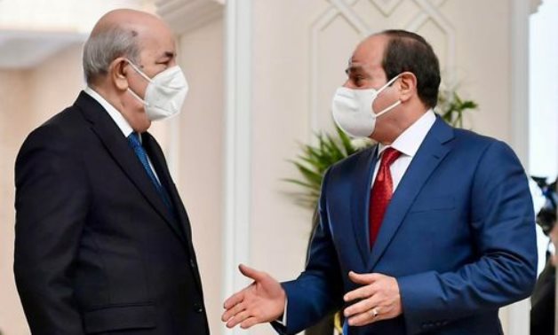 FILE - President Abdel Fatah al-Sisi and his Algerian counterpart Abdel Meguid Taboun