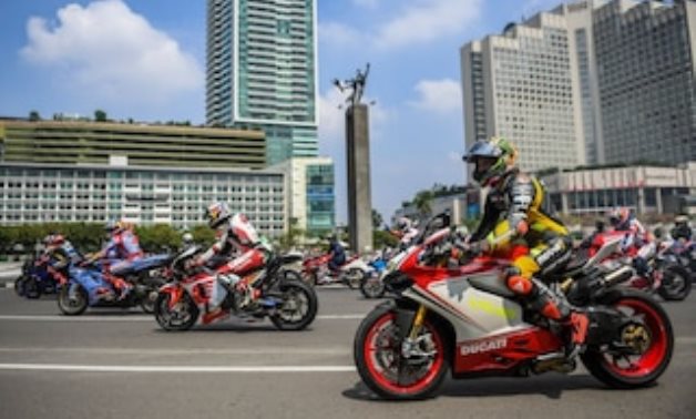 MotoGP racers ride passing the Bundaran Hotel Indonesia roundabout as they take part on a parade, ahead of the Indonesian Grand Prix, Reuters 
