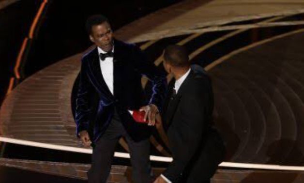 File: Will Smith slaps Chris Rock at the Oscars stage.