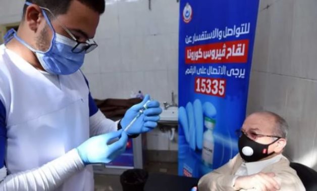 A man receives a coronavirus vaccine shot in a vaccination center in Egypt - FILE
