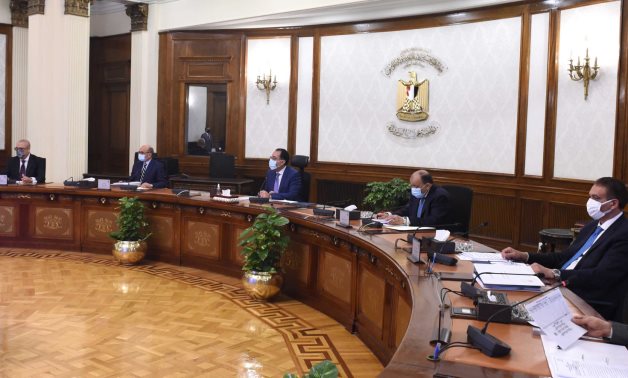 Meeting of Prime Minister Mostafa Madbouli, and committee in charge of legalizing unlicensed buildings on April 20, 2021. Press Photo 