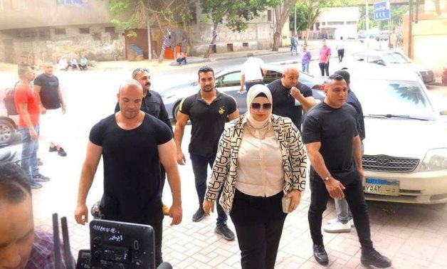 Asmaa Emad, AKA the Princess of Biology, outside Alhosabir Theater surrounded by bodyguards. 