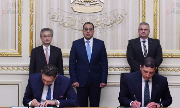 Signing of an MoU for Japan's Sumitomo to build its world largest automotive braided cable factory in Egypt. June 8, 2022. Press Photo 