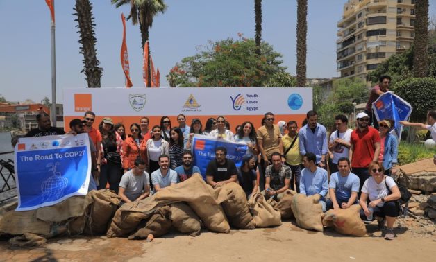 Volunteers of Youth Love Egypt Foundation and Orange who carried out a campaign to clean Nile River banks at Zamalek in June 2022. Press Photo