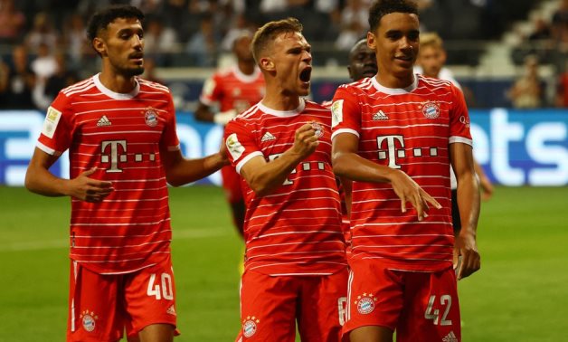Bayern Munich's Jamal Musiala celebrates scoring their sixth goal with Joshua Kimmich and Noussair Mazraoui REUTERS/Kai Pfaffenbach