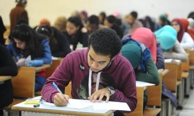 FILE - A student taking an exam in Egypt