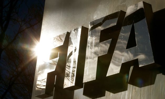 The sun is reflected in FIFA's logo in front of FIFA's headquarters in Zurich, Switzerland November 19, 2015. REUTERS/Arnd Wiegmann