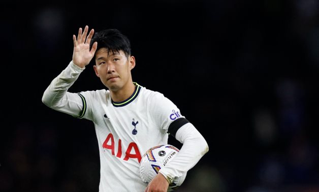 Tottenham Hotspur's Son Heung-min celebrates after the match with the match ball after completing his hat-trick Action Images via Reuters/Peter Cziborra