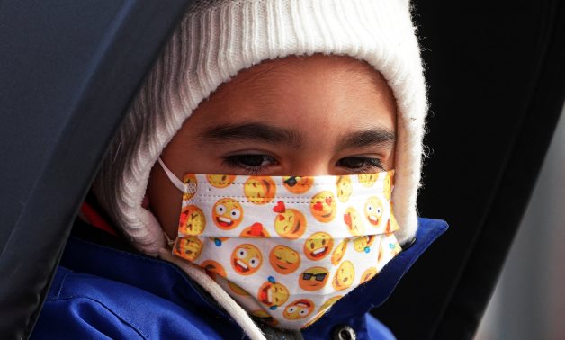 Child wearing mask - REUTERS