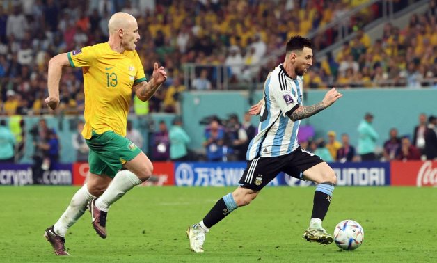 Australia's Aaron Mooy in action with Argentina's Lionel Messi REUTERS/Pedro Nunes