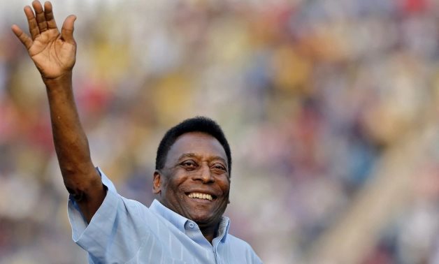 Legendary Brazilian soccer player Pele waves to the spectators before the start of the under-17 boys' final soccer match of the Subroto Cup tournament at Ambedkar stadium. REUTERS/Anindito Mukherjee
