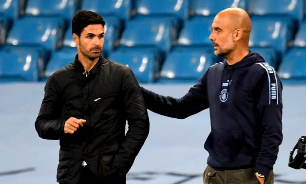 Manchester City manager Pep Guardiola and Arsenal manager Mikel Arteta after the match as play resumes behind closed doors following the outbreak of the coronavirus disease Peter Powell/Pool via REUTERS