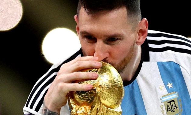 Argentina's Lionel Messi kisses the trophy as he celebrates winning the World Cup REUTERS/Carl Recine/File Photo