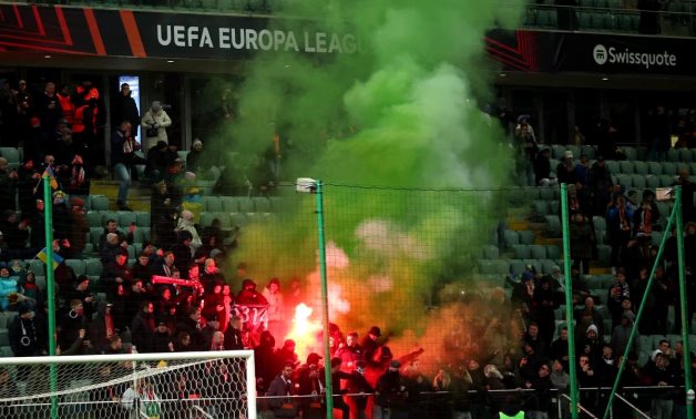 Feyenoord fans with flares before the match REUTERS/Kacper Pempel