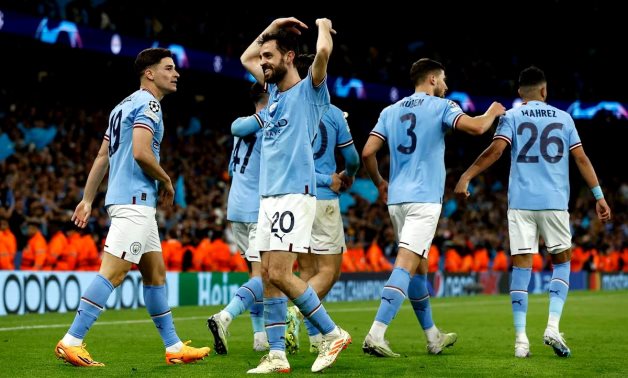  Manchester City's Julian Alvarez celebrates scoring their fourth goal with Bernardo Silva Action Images via Reuters/Jason Cairnduff