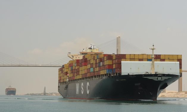 FILE - Cargo ship in Suez Canal