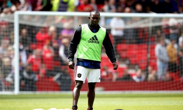 Manchester United's Dwight Yorke during the warm up before the match Action Images via Reuters/Ed Sykes