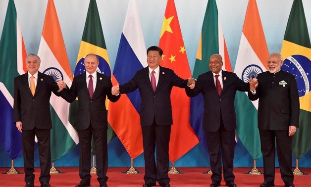 (L-R) Brazil's President Michel Temer, Russian President Vladimir Putin, Chinese President Xi Jinping, South Africa's President Jacob Zuma and Indian Prime Minister Narendra Modi pose for a group photo during the BRICS Summit at the Xiamen International C