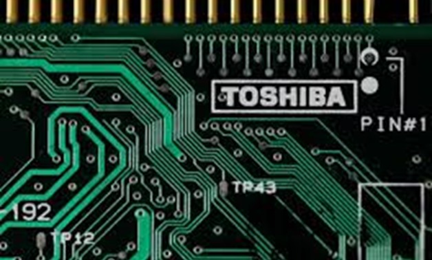 FILE PHOTO: A logo of Toshiba Corp is seen on a printed circuit board in this photo illustration taken in Tokyo July 31, 2012. REUTERS/Yuriko Nakao/File Photo
