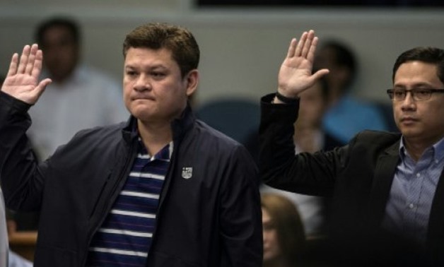 © AFP | Paolo Duterte (L) and Manases Carpio (R) denied accusations that they helped facilitate the shipment of crystal methamphetamine worth 6.4 billion pesos ($125.4 million) into the Philippines from China in exchange for payment
