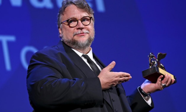 Director Guillermo Del Toro holds the Golden Lion award for the best movie "The shape of water" during the awards ceremony at the 74th Venice Film Festival in Venice, Italy September 9, 2017. REUTERS/Alessandro Bianchi