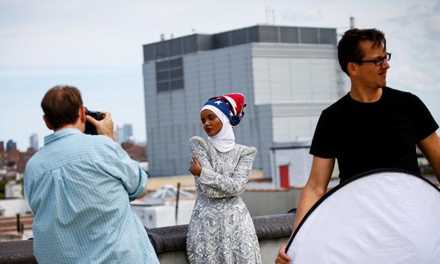 Fashion model and former refugee Halima Aden, who is breaking boundaries as the first hijab wearing model gracing magazine covers and walking in high profile runway shows poses during a shoot at a studio in New York City, U.S .August 28, 2017. Photo taken
