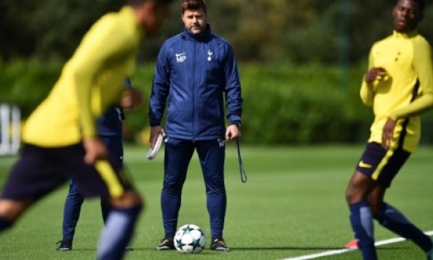 © AFP / by Steven GRIFFITHS | Tottenham coach Mauricio Pochettino leads a training session at the club's Enfield Training Centre in north-east London on September 12, 2017, the eve of their Champions League group match against Borussia Dortmund