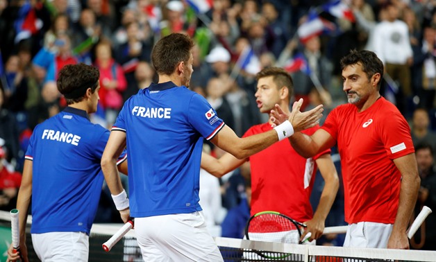 Nicolas Mahut and Pierre-Hugues Herbert shake hands with Serbia's Filip Krajinovic And Nenad Zimonjic after winning their doubles match – Press image courtesy Reuters.