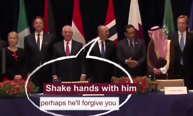 The foreign ministers of Turkey, Qatar and Saudi Arabia (middle) in a still image from a YouTube video 